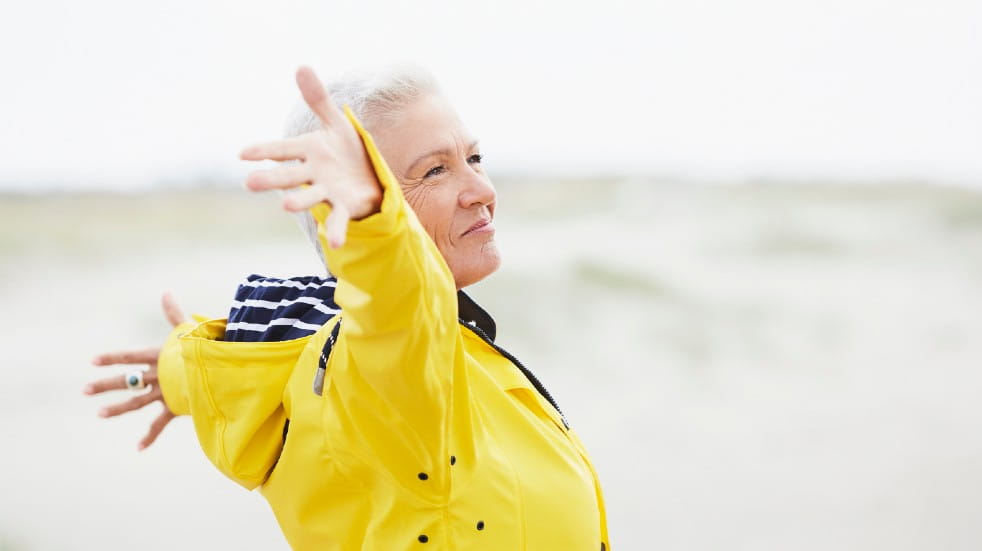 Retirement planning tips senior woman spreading arms